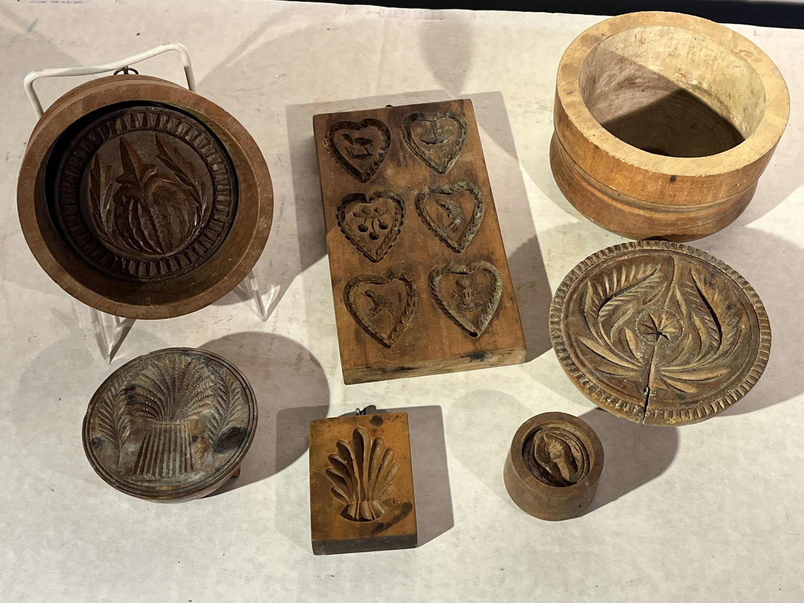 Collection of 7 Wood Butter Molds: A collection of 7 hand-carved wood butter molds, 18th and 19th century.