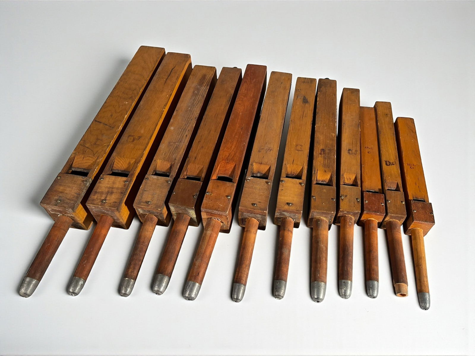 A Collection of 12 Medium Sized Organ Pipes: A collection of 12 medium wood church organ pipes. 27" largest