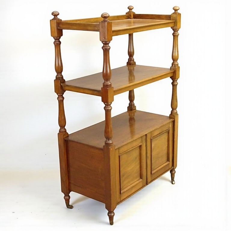 Victorian Etagere: A 19th century English Victorian etagere with lower 2-door cabinet with working lock and key, on brass casters, light mahogany. 16" d x 30" w x 48" h