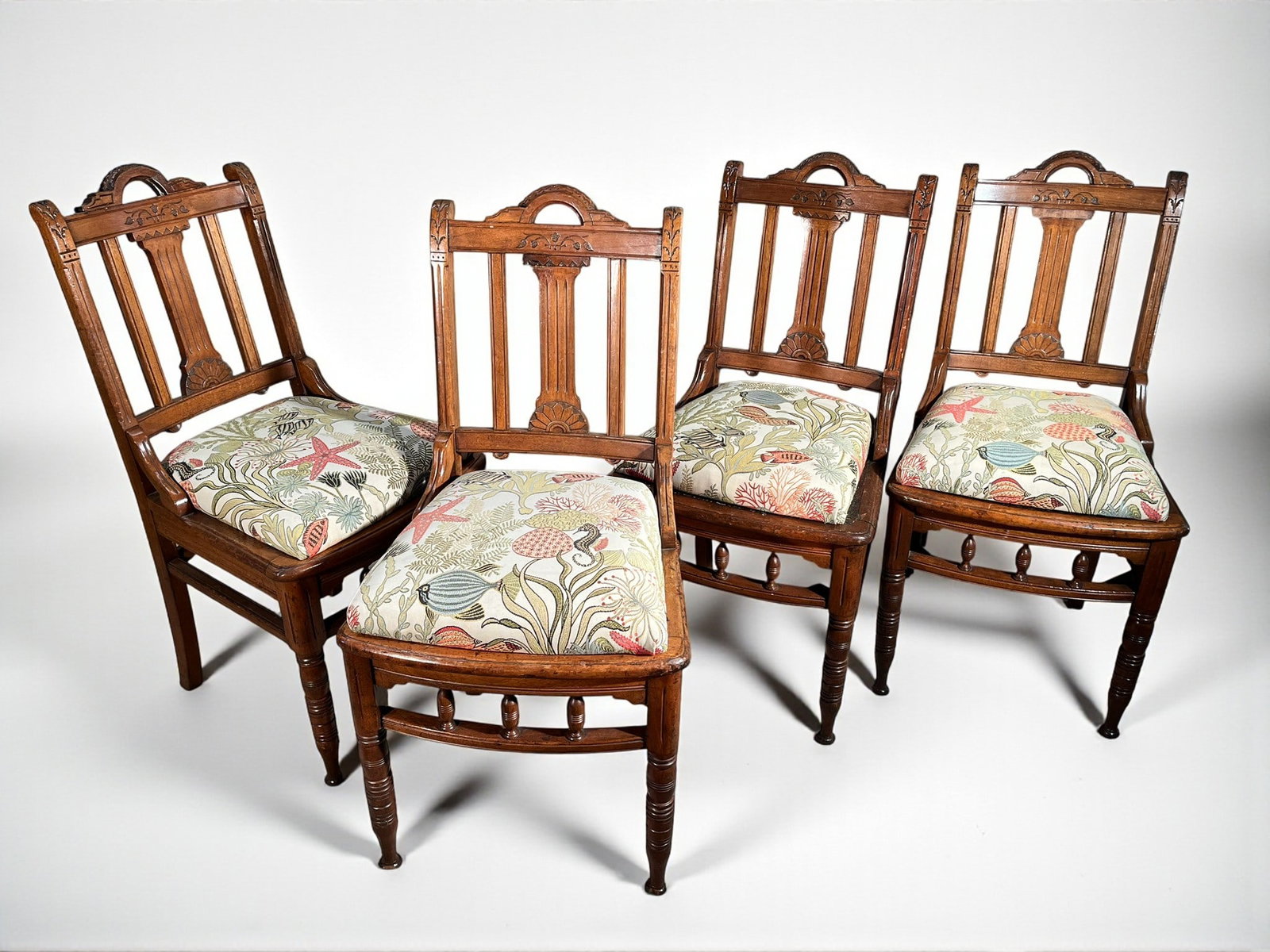 Set of 4 Country Chairs: A set of 4 late 19th century aesthetic revival chairs in oak with upholstered slip seats.