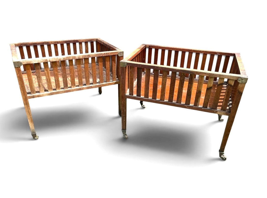 Pair of Louis XVI Style Wood Planters: A pair of Louis XVI style wood planters with lattice sides, circa 1930's, brass foot cups with casters. 17" d x 24" w x 19" h each
