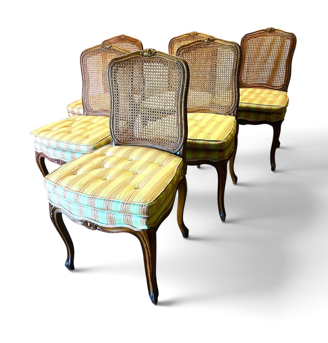 Set of 6 Louis XV Style Dining Chairs: A set of 6 Louis XV style dining chairs in walnut stained beech, with caned backs and upholstered seats, circa 1920. 21" w x 19.5" d x 36" h x 18" seat height