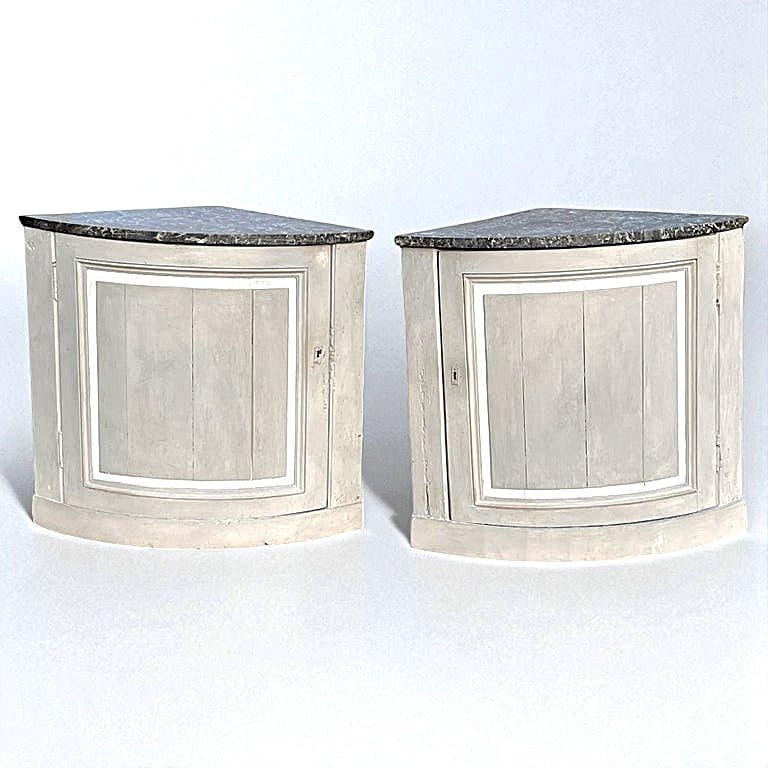 Pair of French Louis XVI Corner Cabinets: A pair of French Louis XVI period corner cabinets, circa 1790, in grey painted finish with cream trim, with dark grey marble tops.25" x 25" x 31" h.