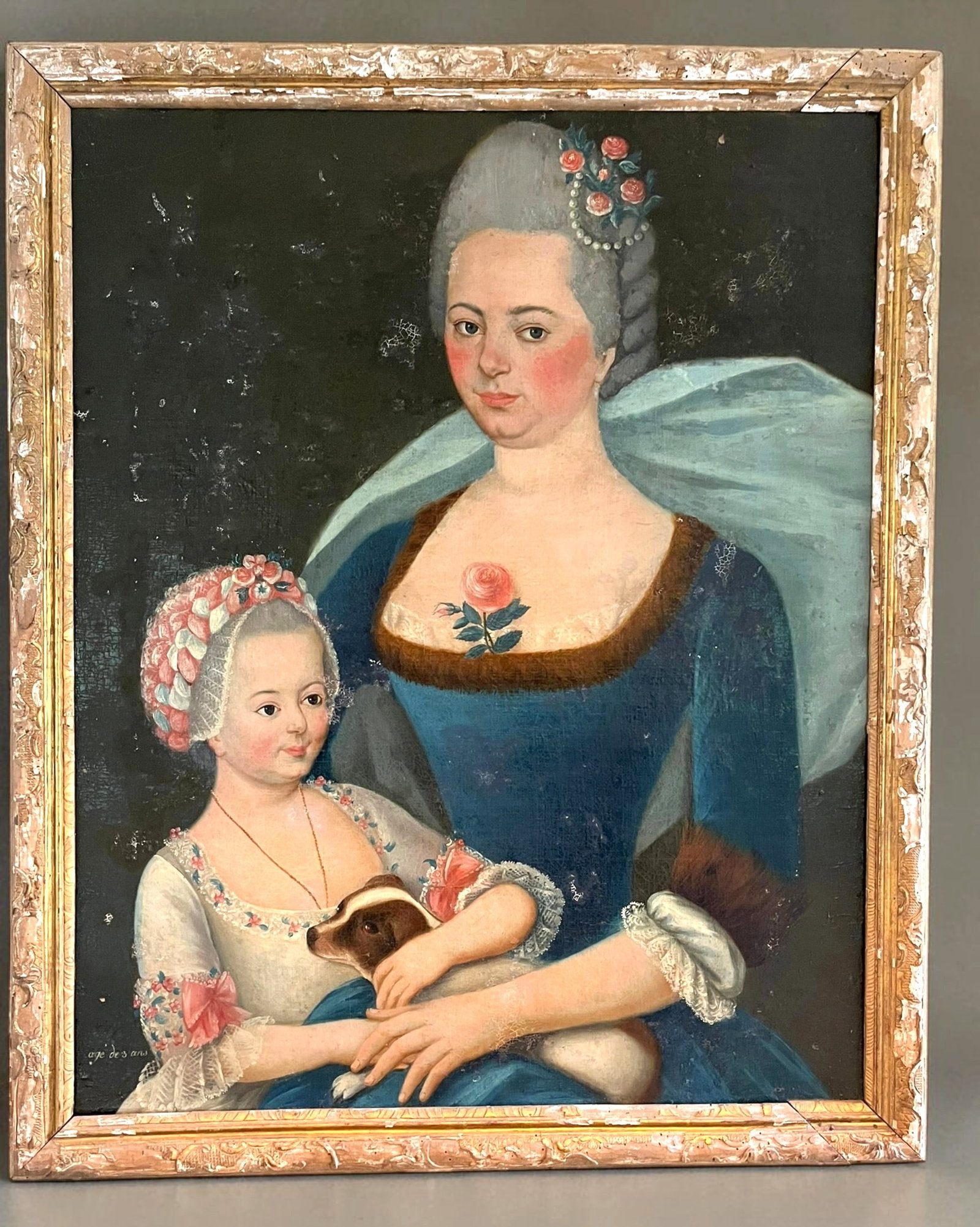 Large Portrait of a Woman and Child, With Dog, French 18th Century: A large naive portrait of a Lady with a small child and her dog, French circa 1770, in a period giltwood frame. The portrait has the words "age de 3 ans" indicating the age of the child. From the priv