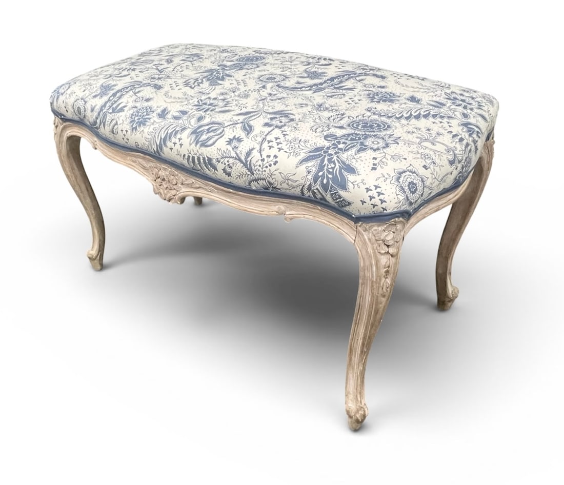 French Louis XV Style Bench: A French Louis XV style bench, in stripped beech, upholstered in blue and white toile. Circa 1900. 17"d x 27" w x 18" h