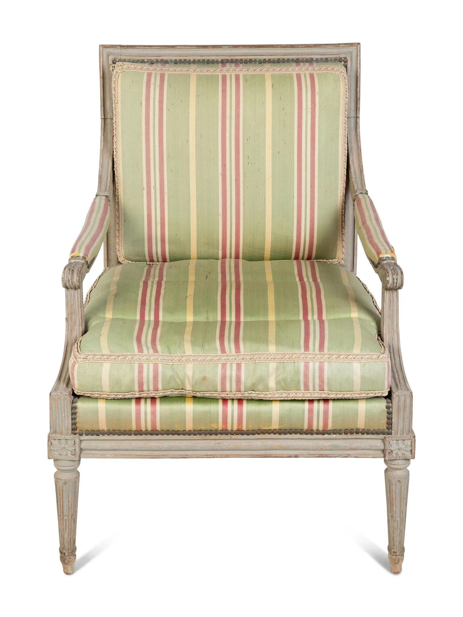 French Louis XVI Armchair, 19th Century: A French Louis XVI style armchair in original distressed grey paint, fluted legs and upholstered in an old silk striped fabric. 26" w x 25" d x 35" h x 18" seat h