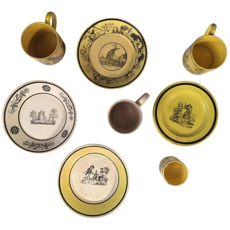 Antique Creil Demitasse Cups and Saucers: A collection of early 19th century Creil et Montereau demitasse cups and saucers in yellow and white glaze, with transferware scenes. 5" dia average.