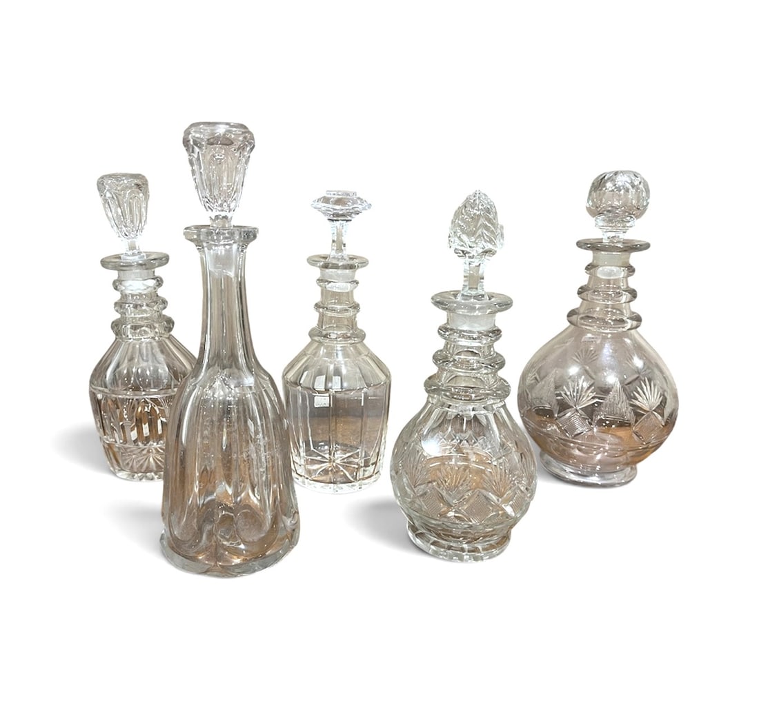 Collection of 5 Cut-Crystal Decanters: A collection of 5 cut-crystal decanters, mid 19th century. 10" average h
