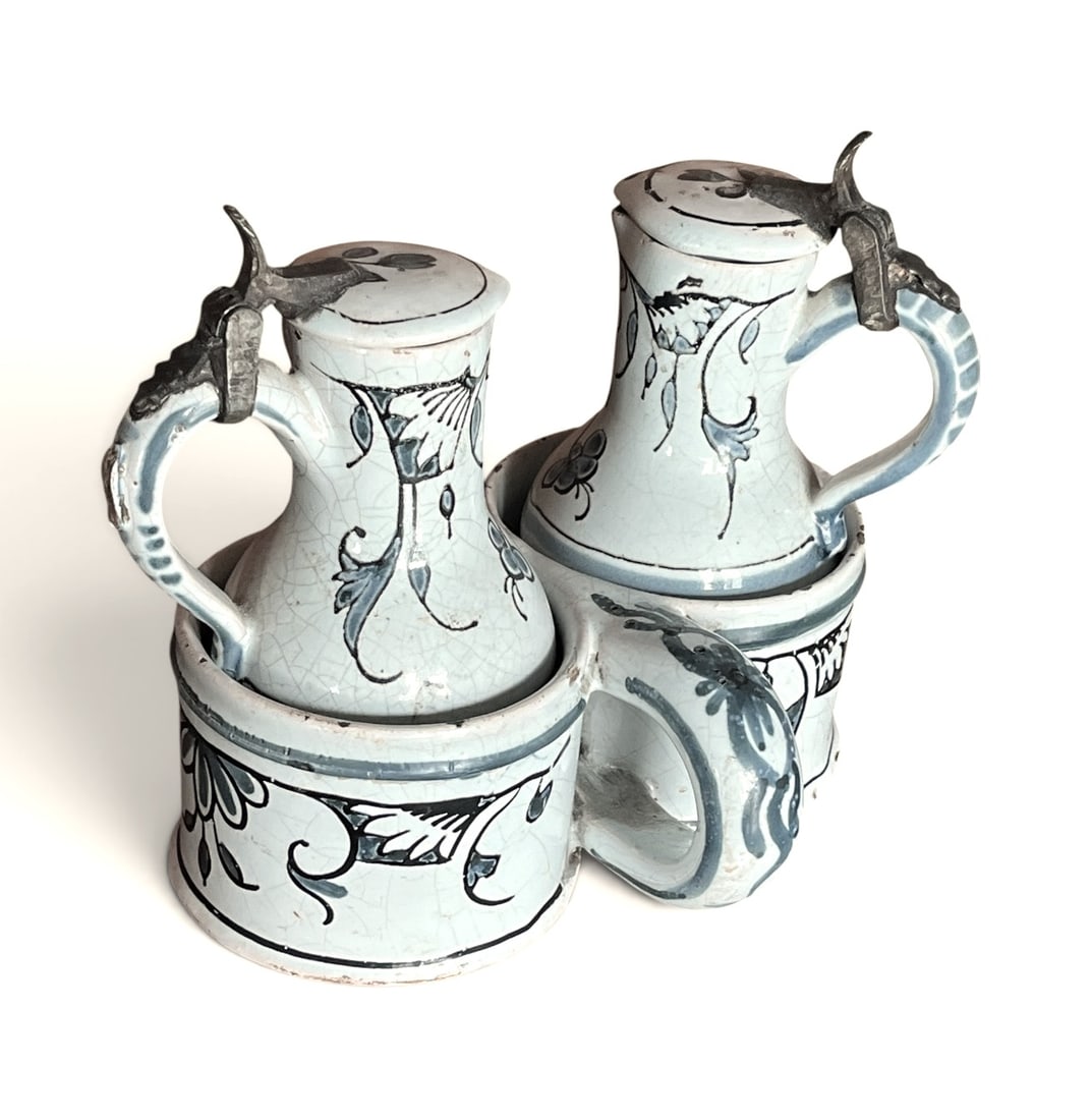 18th Century French Cruet Set: An 18th century French cruet set, possibly Moustiers, with original holder. 6.3" w x 5" h