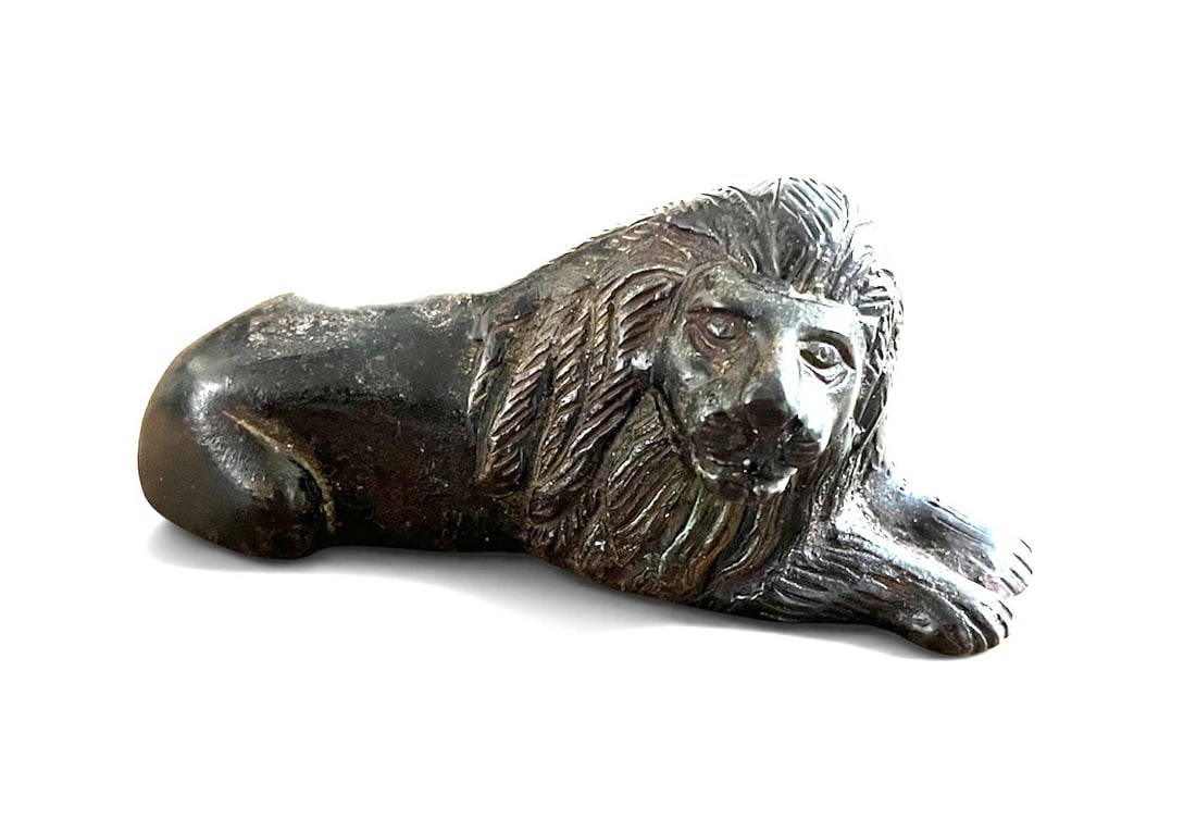 Bronze Recumbent Lion, Italian 18th Century: A small bronze figure of a recumbent lion, Italian 18th century. 6" w x 3" h.