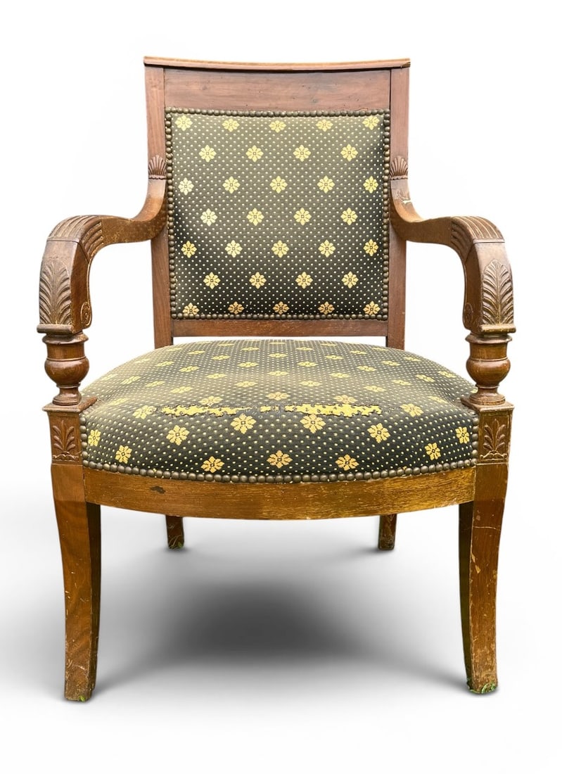 French Restauration Period Armchair: A French Restauration Period fauteuil, circa 1800, in walnut, upholstered seat and back.24" w x 20" d x 36" h