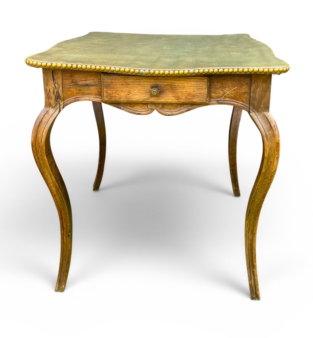 French 18th Louis XV Game Table: A French 18th century Louis XV game table in oak with green leather top, two small drawers in the apron and cabriole legs.