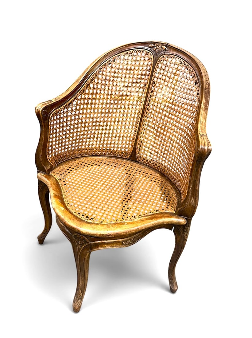 French Louis XV Fauteuil a Bureau: A French desk chair in walnut with caned seat and back, 19th century, Louis XV style. 24" w x 25" d x 35" h