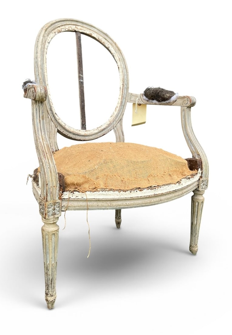 French Louis XVI Fauteuil 18th Century: A French 18th century Louis XVI armchair in original grey paint, medallion back with fluted legs, circa 1790. 17" d x 23" w x 34" h