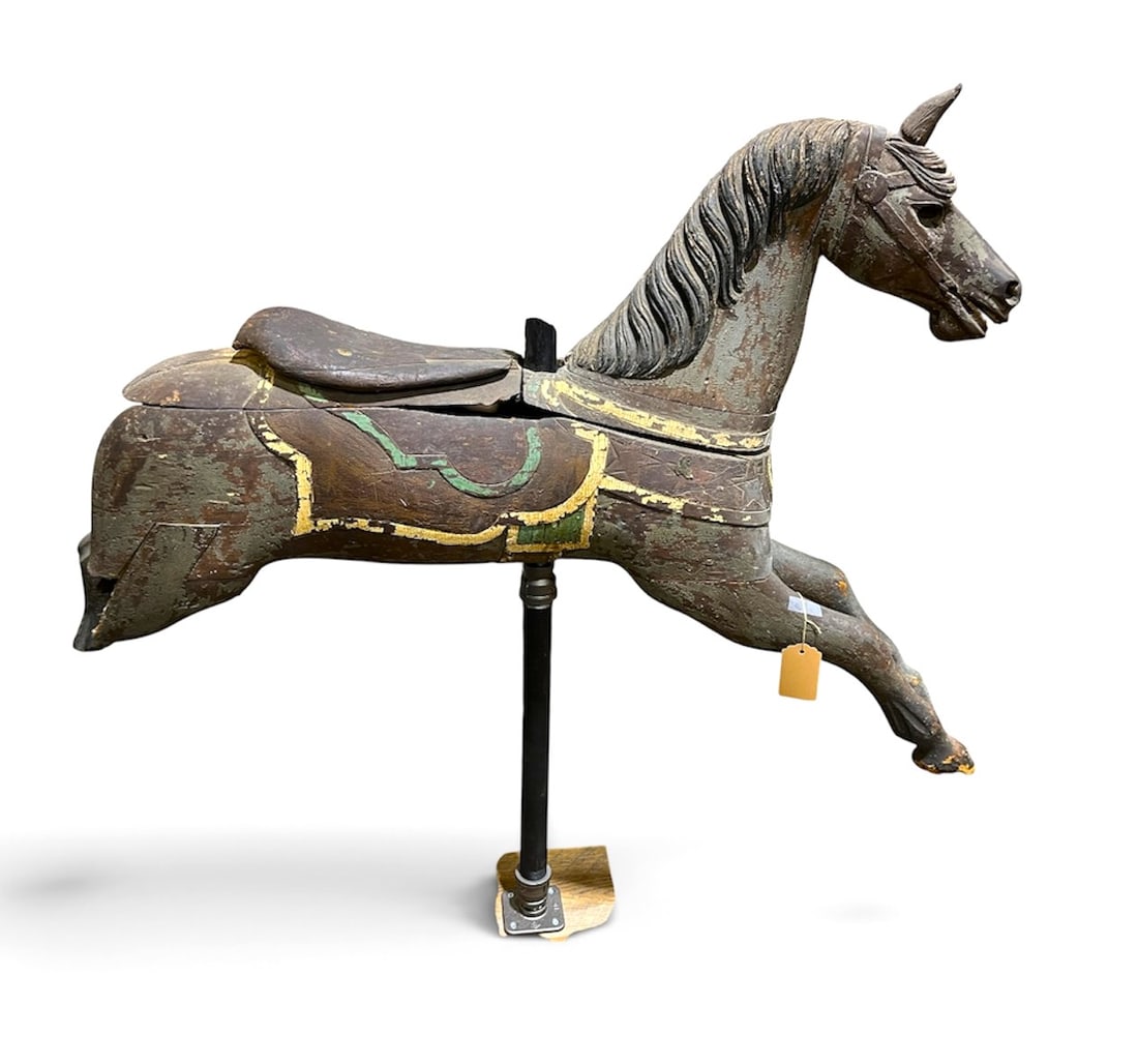 Antique Carousel Horse: An early carousel horse in "as-found" condition, lacking a leg and an ear etc. More folk-art sculpture than anything. Old paint. 54" w x 11" d x 49" h on stand