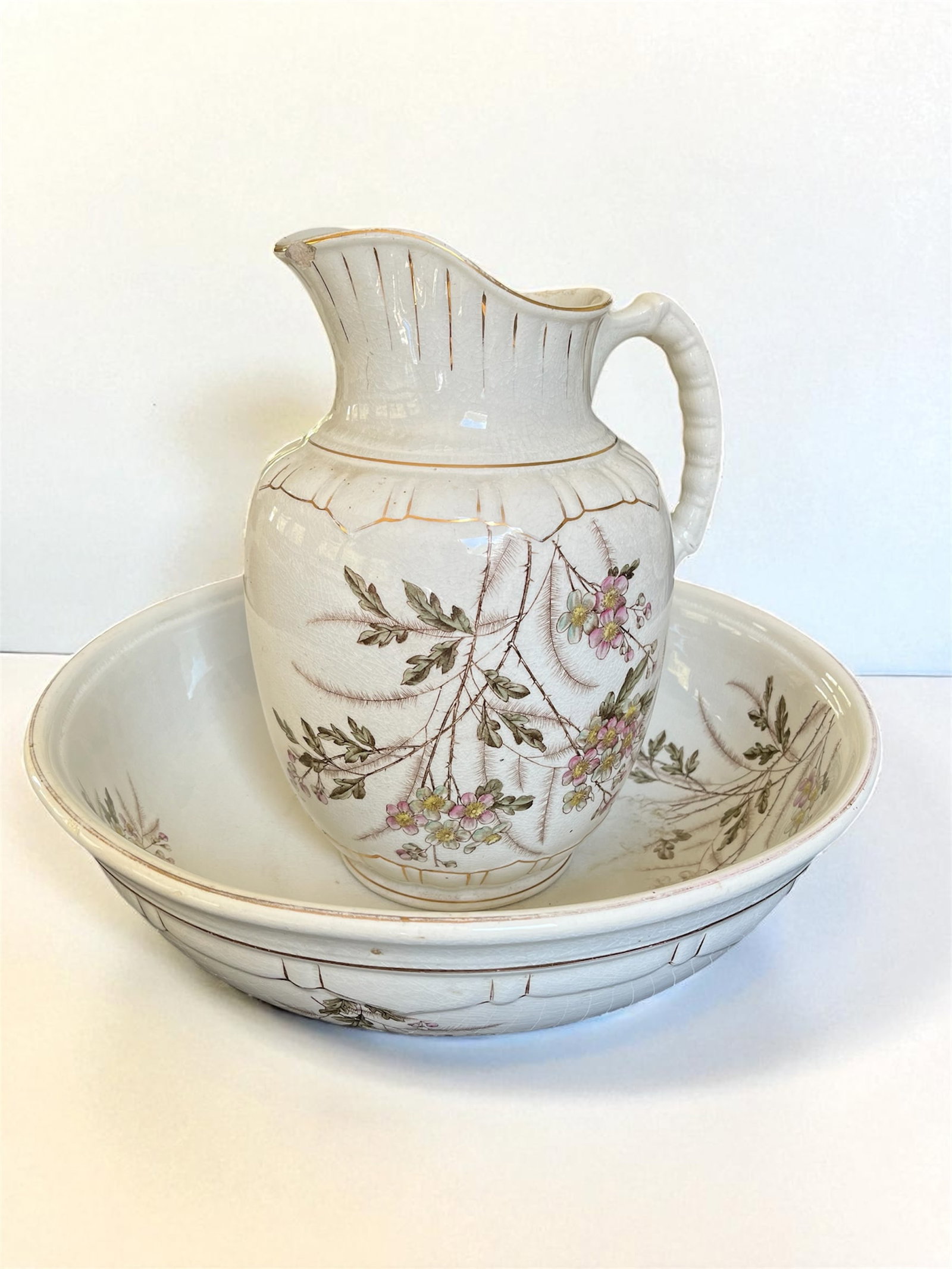 Antique Wash Bowl and Pitcher: An antique ceramic wash bowl and pitcher, Ironstone, J.M. & Co. 15" dia. x 12" h