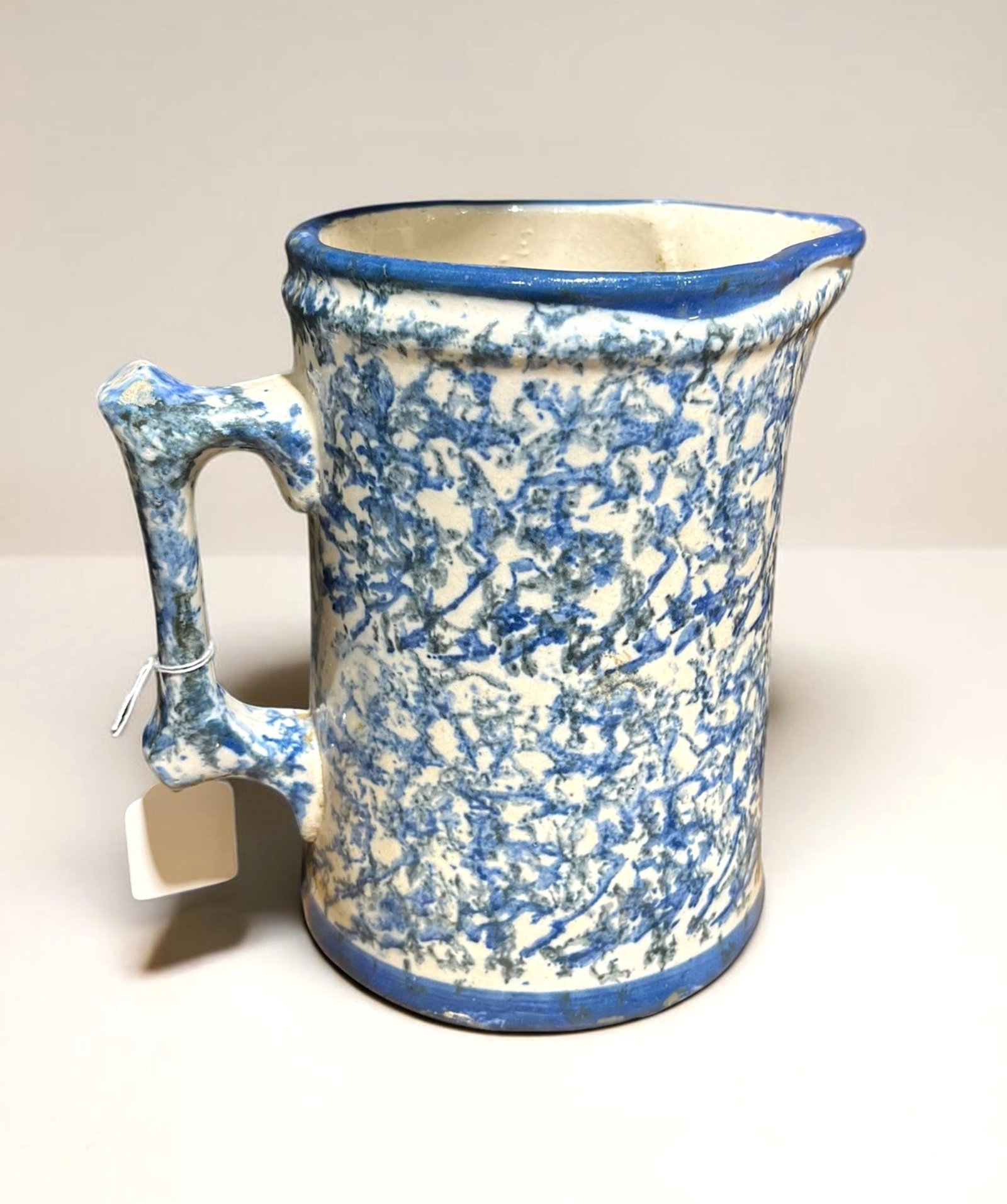 Spongeware Pitcher: An antique blue and white spongeware pitcher, circa 1900.