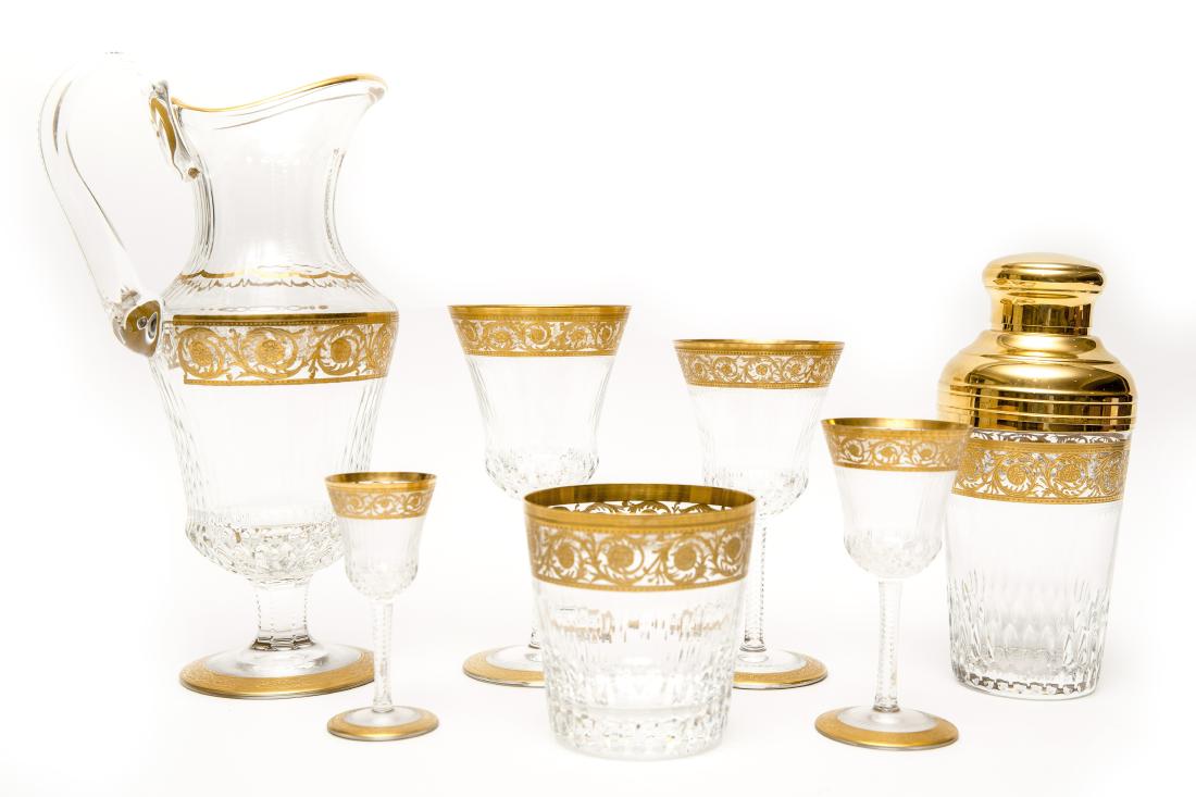 French Saint Louis Crystal Gilt Thistle Stemware: 108 piece stemware service in gilt thistle pattern by French crystal maker Saint Louis: 28 glasses (7"H) 23 glasses (6 1/4"H) 15 small wine glasses (5 1/8"H) 18 cordials (4 1/8"H) 20 large rocks glass