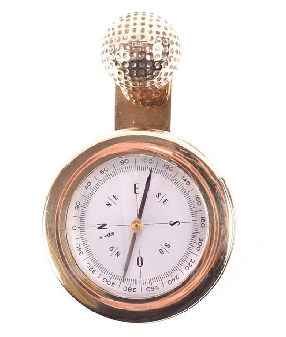 A Hermes silver gilt golf ball compass  the face within (1 of 8)