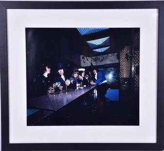 A 1970 Rolling stones framed photograph by Ethan: A 1970 Rolling stones framed photograph by Ethan Russell depicting the band in a bar, used for Rock images book with Mick Taylor, within a glazed frame with black border, 33 cm x 38 cm.