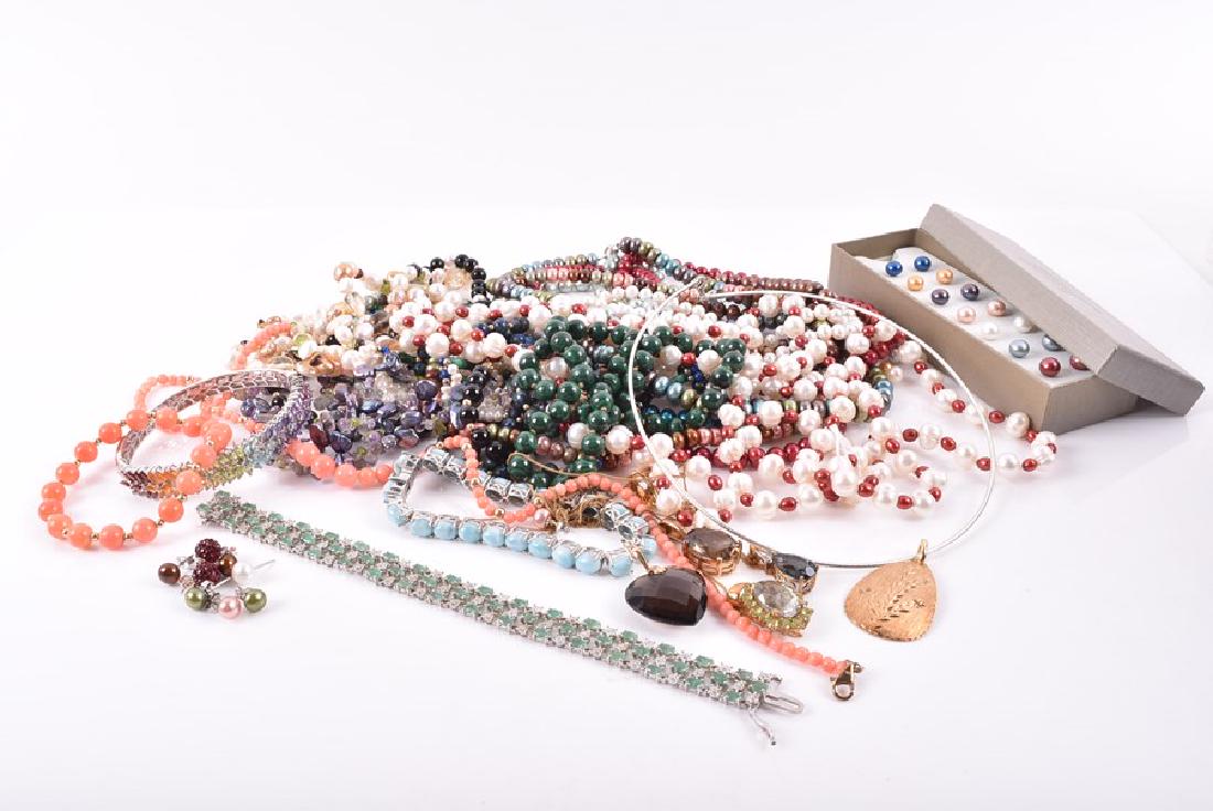 A silver and emerald openwork bracelet  set with (1 of 11)