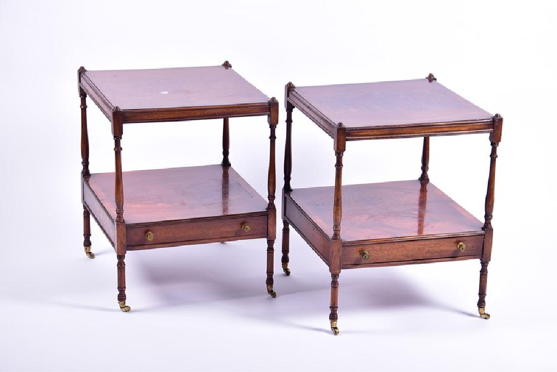 A pair of George III style mahogany nightstands each: A pair of George III style mahogany nightstands each of square form with quarter veneered surface, on turned poles above a single frieze drawer with turned brass handles, supported on turned legs