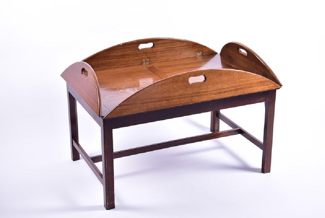 A large early 20th century mahogany butler's tray on: A large early 20th century mahogany butler's tray on stand 122 cm x 90 cm x 63 cm high.