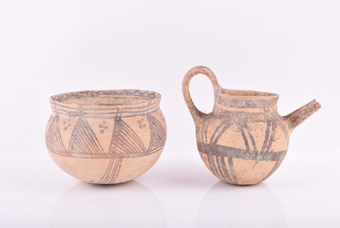 Two pieces of Cypriot wheel thrown white painted ware,: Two pieces of Cypriot wheel thrown white painted ware, possibly Late Bronze Age both decorated with black on white geometric patterns.(2).