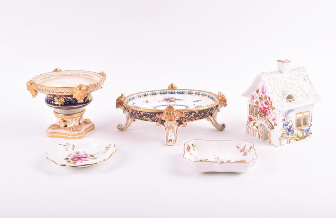 An early 19th century Bloor Derby porcelain pot pourri: An early 19th century Bloor Derby porcelain pot pourri base modelled as a classical urn, together with a Copeland 'Trapnell' sauce boat stand, a 19th century style pastille burner and two 20th century
