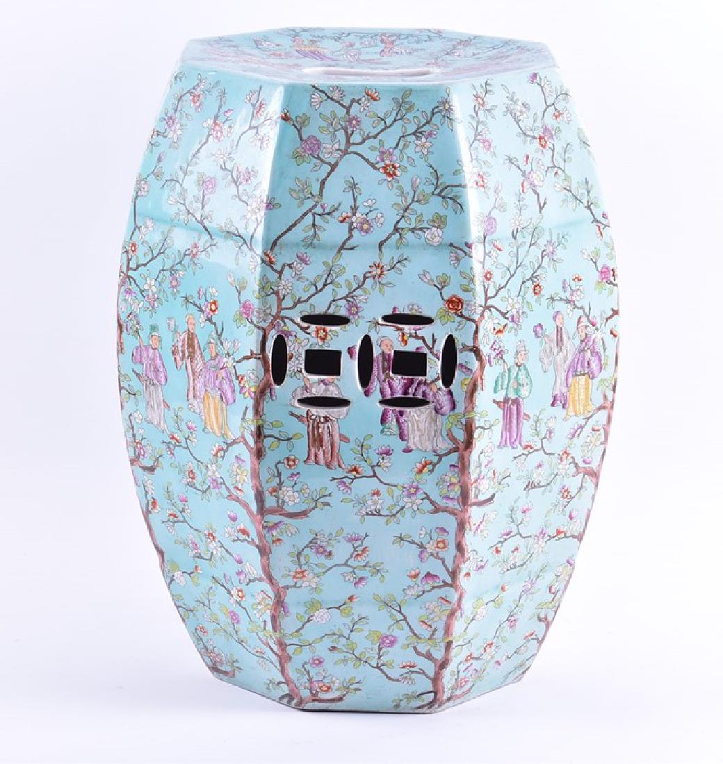 A 19th century chinoiserie Copeland Spode garden: A 19th century chinoiserie Copeland Spode garden stool decorated in the Chinese Famille Verte style with scenes of scholars surrounded by intertwined cherry blossom trees. 48 cm high x 32 cm wide