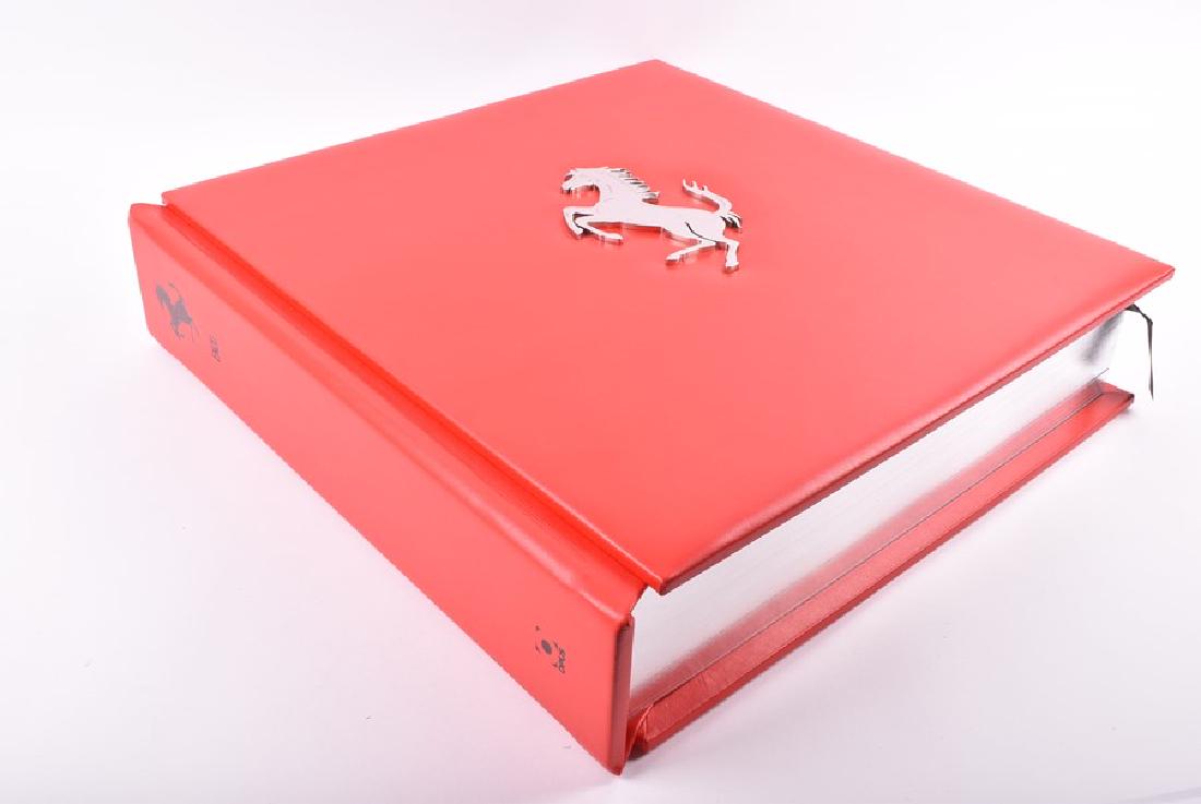 The Official Ferrari Opus: "Enzo" limited edition #343: The Official Ferrari Opus: "Enzo" limited edition #343 of 500, signed by former Ferrari divers John Surtees CBE, Sir Stirling Moss OBE, Nigel Mansell CBE, Fernando Alonso, Felipe Massa and Niki Lauda 
