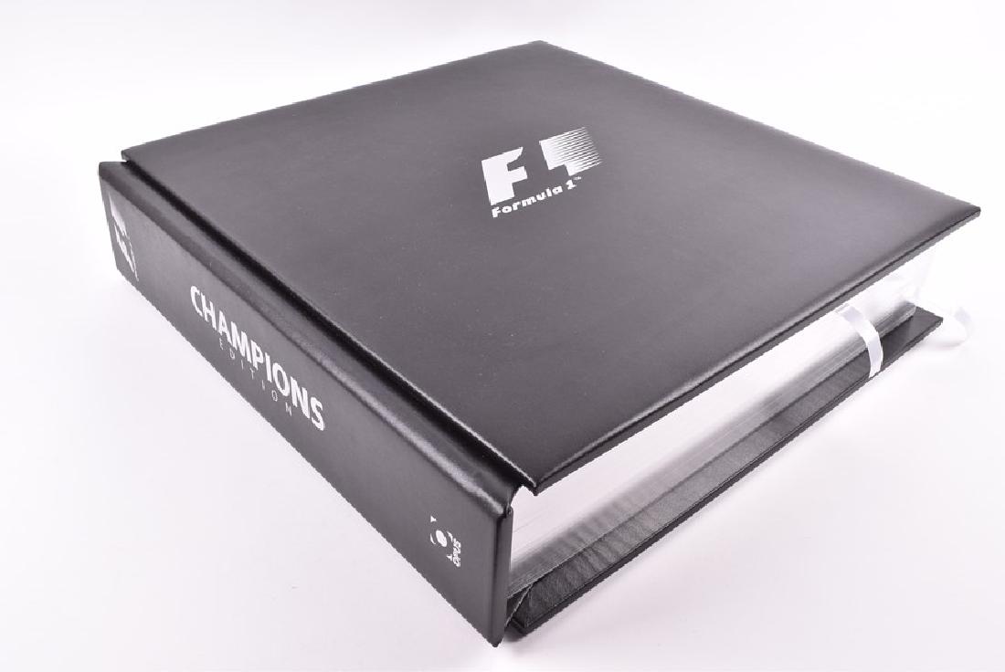 A rare official Formula 1 Opus "Champions Edition": A rare official Formula 1 Opus "Champions Edition" limited edition #37 of 100, dated London 2011, signed to the frontis piece by Bernie Ecclestone 'Bernie', and signed within by the following World Ch