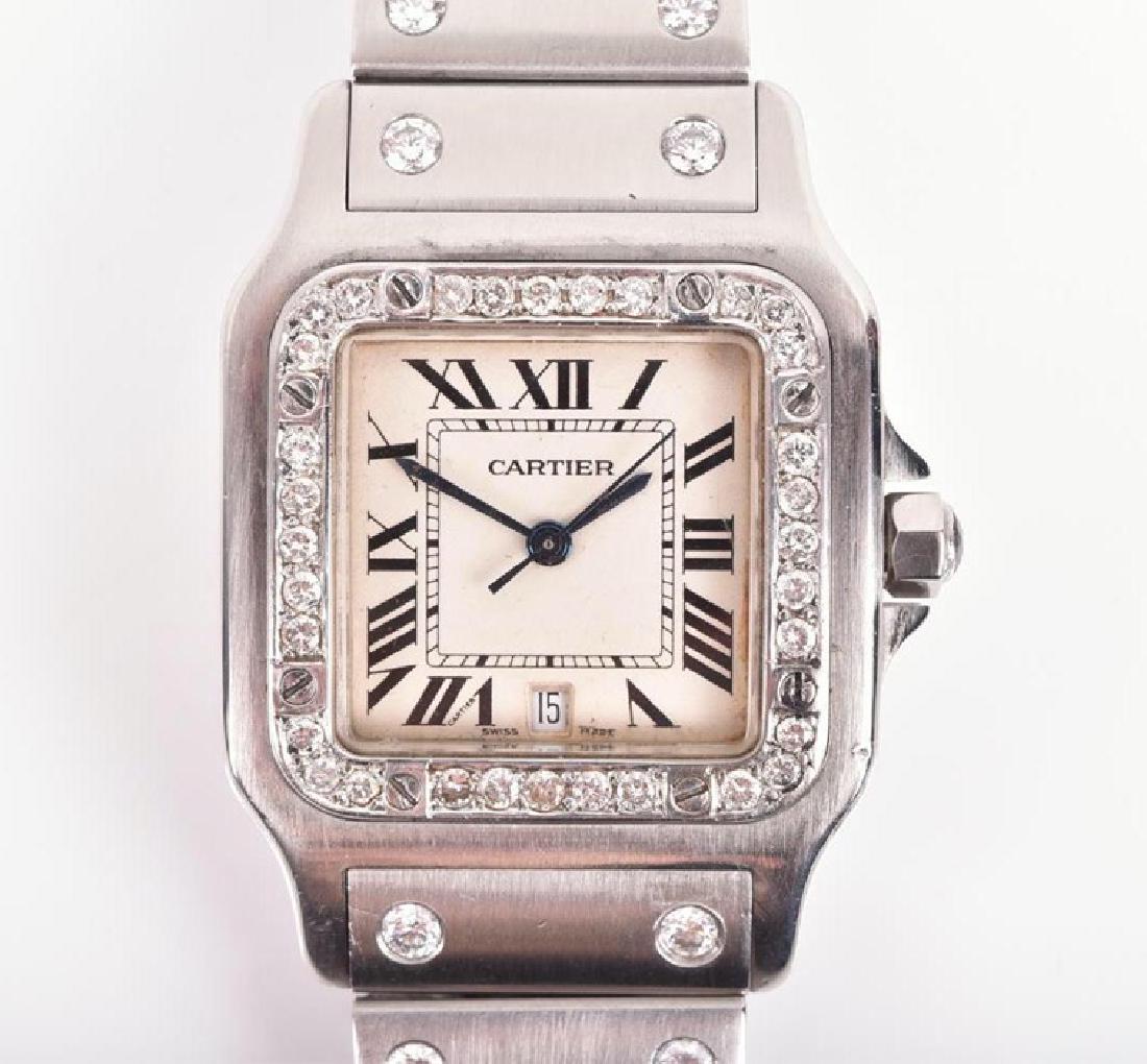 A Cartier Santos stainless steel and diamond wristwatch: A Cartier Santos stainless steel and diamond wristwatch the square silvered dial with black Roman numerals and Cartier signature to the VII, with date aperture, diamond set bezel, and diamonds set to 