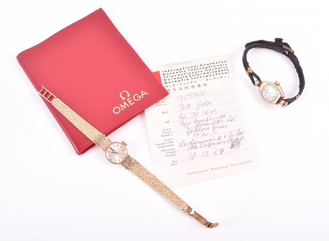 A ladies 9ct gold Omega wristwatch manual, the: A ladies 9ct gold Omega wristwatch manual, the circular silver dial with gilt baton numerals, on a textured mesh bracelet strap with folding clasp, cal. 483 movement, serial number 19593381, with Inte