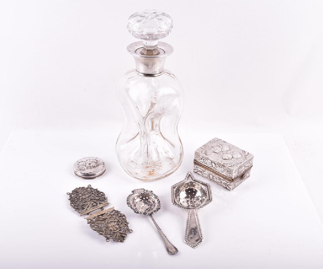 A early 20th century 'Angel' pattern travelling silver: A early 20th century 'Angel' pattern travelling silver curling tongs box London 1901, William Comyns & Sons, along with a selection of other silver and white metal items, including a silver mounted de