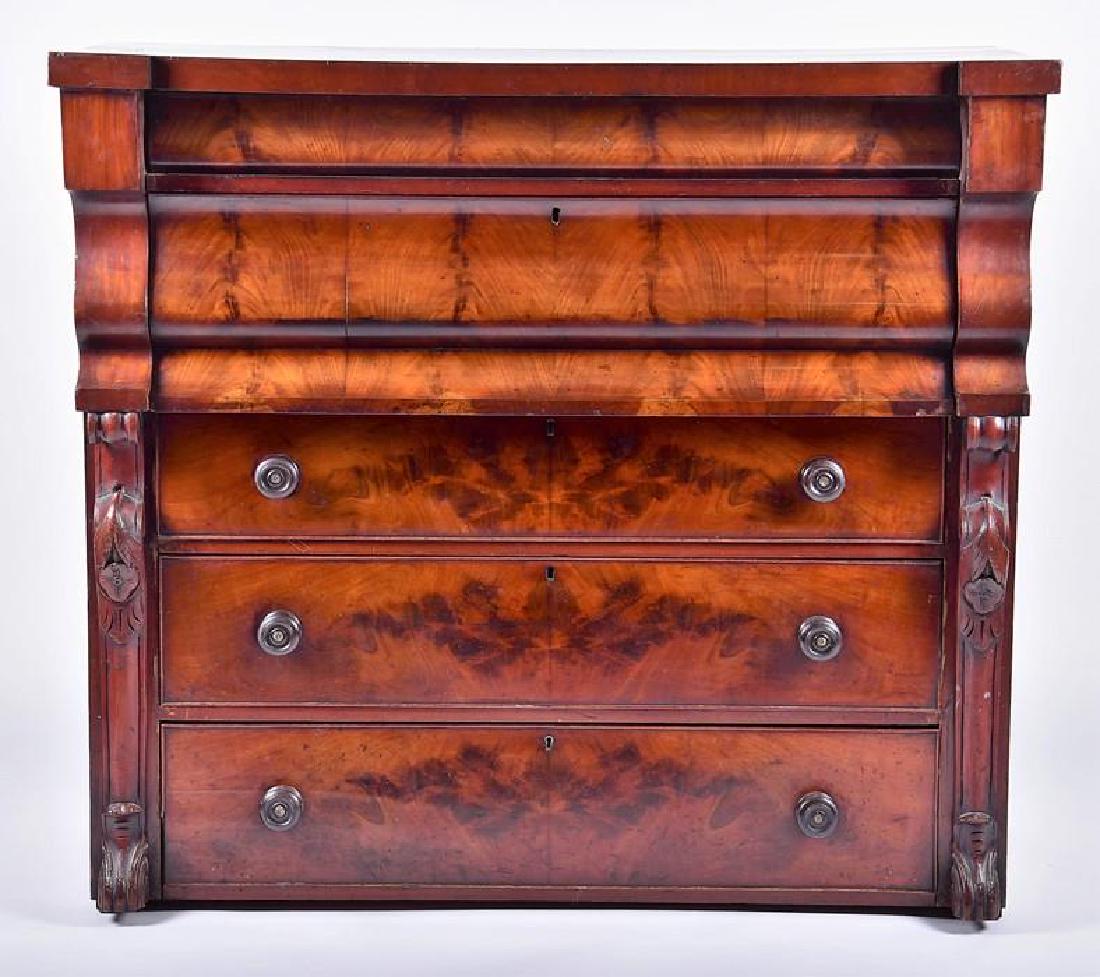 A Victorian Scottish flame mahogany chest with: A Victorian Scottish flame mahogany chest with two slides over three graduated drawers, 114 cm x 126 cm x 56 cm.
