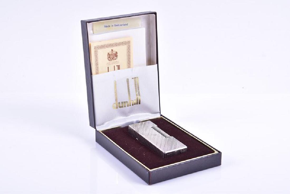 A Dunhill silver plated cigarette lighter in original: A Dunhill silver plated cigarette lighter in original fitted box with instruction booklet.
