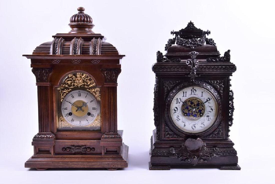 A late 19th century painted wood and brass-mounted: A late 19th century painted wood and brass-mounted mantel clock in the Renaissance style, with a movement by AD Mougin striking on a gong, the enamel dial bearing Arabic numerals, 44 cm high, together