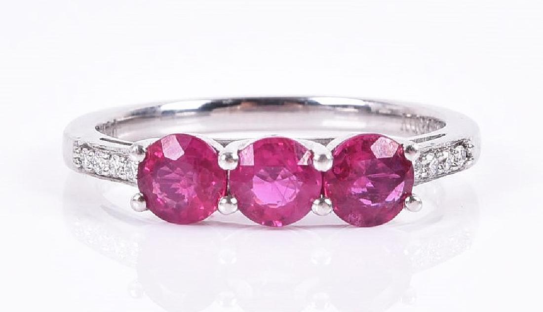 A platinum, diamond, and ruby ring  set with three (1 of 4)
