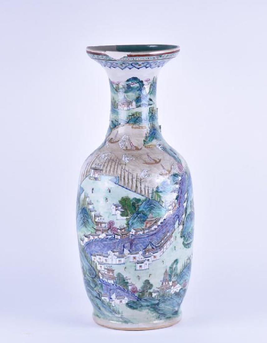 A large 19th century Qing dynasty porcelain baluster: A large 19th century Qing dynasty porcelain baluster vase painted throughout with polychrome colours and applied enamels depicting mountainous lands and boats on rivers, with flared rim, the body with