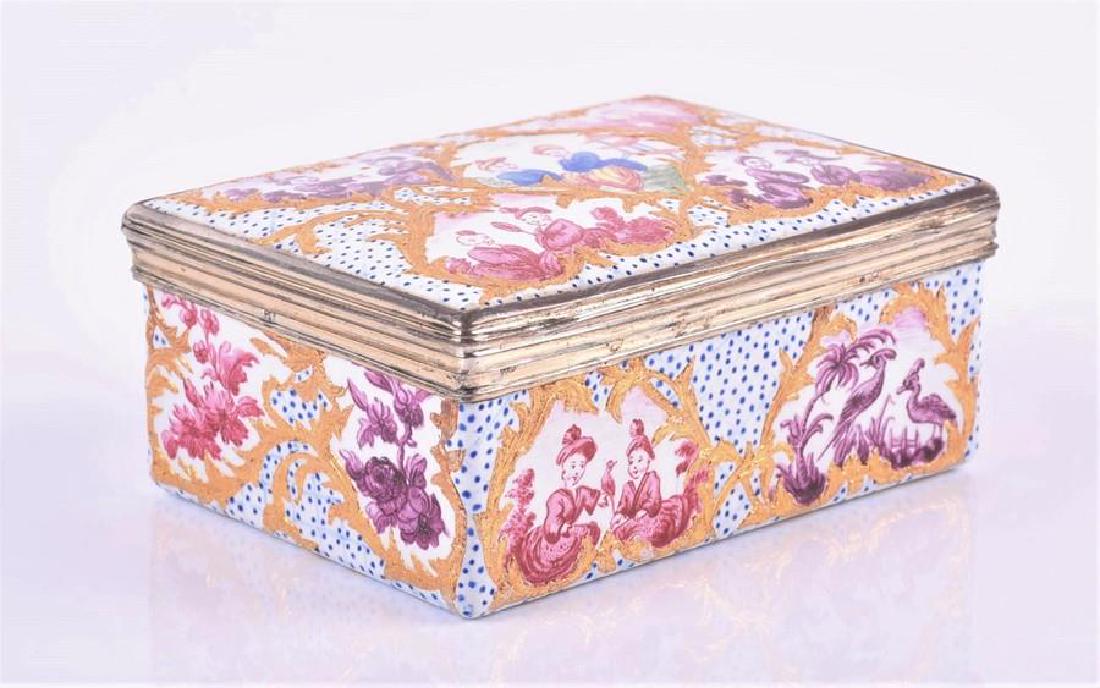 An 18th century Continental rectangular enamel box: An 18th century Continental rectangular enamel box with hinged cover, decorated to all sides in the chinoiserie taste with vignettes of figures, birds and flora, finished with gilt scrolls and blue do