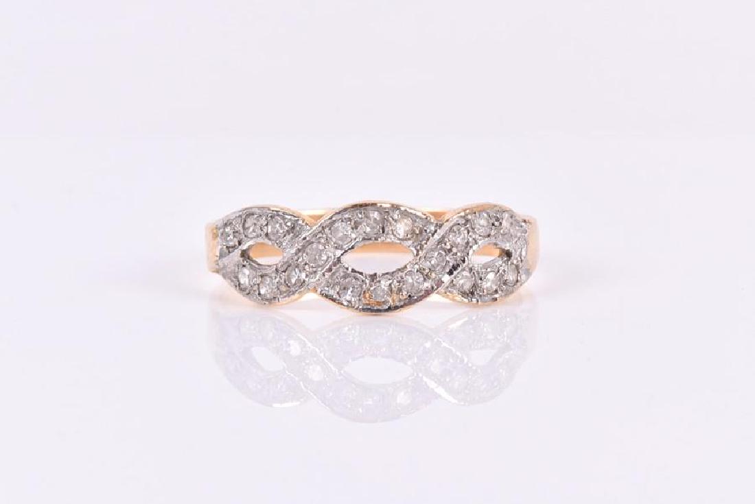 An 18ct yellow gold and diamond ring the ribbon-twist: An 18ct yellow gold and diamond ring the ribbon-twist mount, inset with round-cut diamonds, size Q, 3 grams.