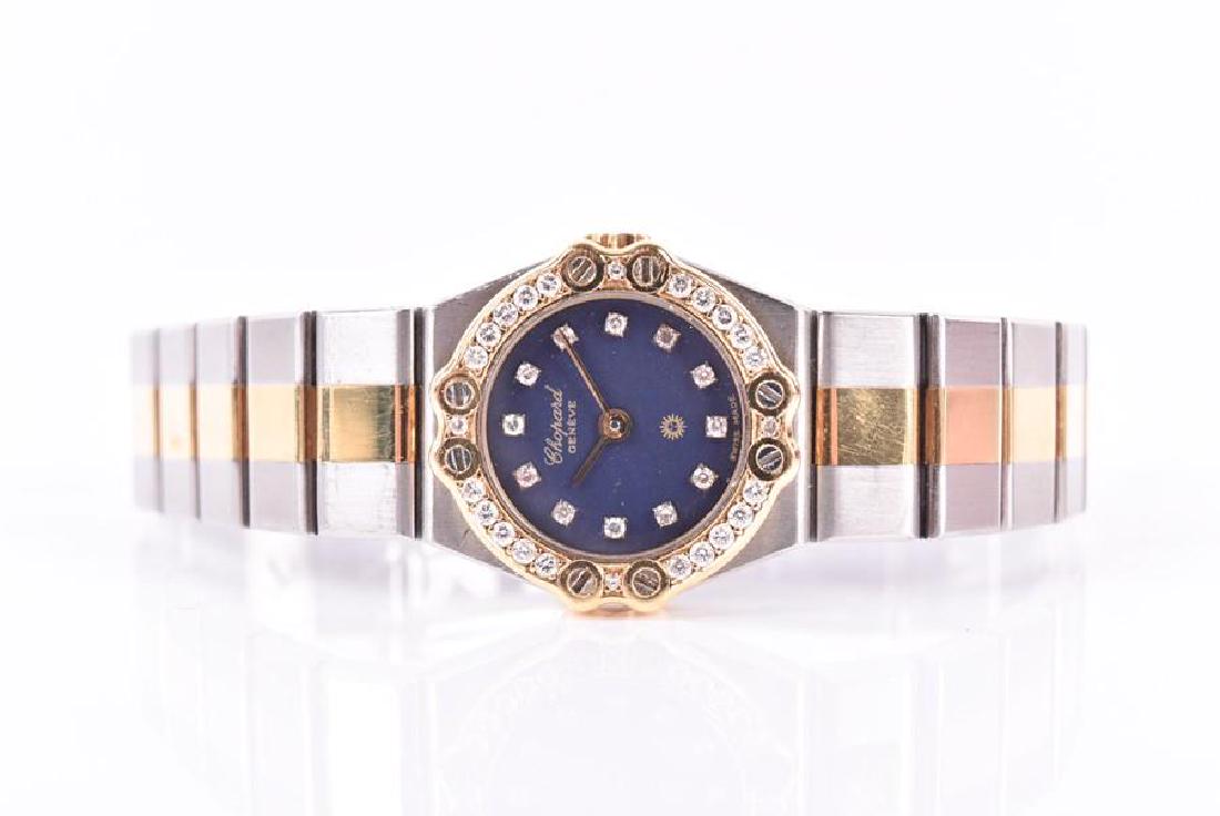 Chopard. A ladies St Moritz stainless steel and diamond: Chopard. A ladies St Moritz stainless steel and diamond wristwatch with black diamond-set dial, within yellow gold diamond-set bezel, on stainless steel strap, together with two spare links.