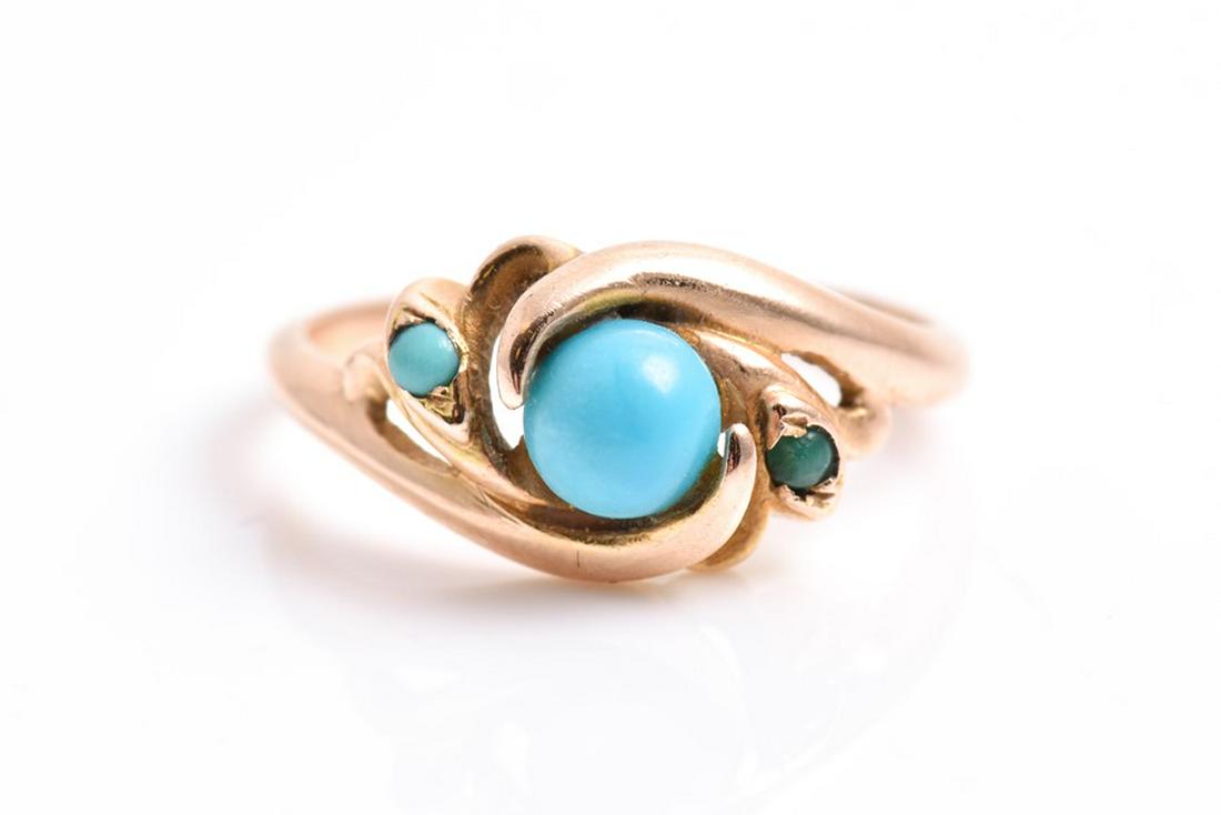 A yellow metal and turquoise crossover ring in the Art: A yellow metal and turquoise crossover ring in the Art Nouveau style (indistinct mark to outer shank, tests as gold), size L, together with a 9ct yellow gold chain. (2)