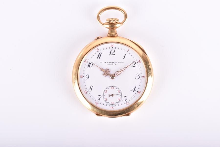 Patek Philippe. An 18ct yellow gold pocket watch the: Patek Philippe. An 18ct yellow gold pocket watch the white enamel dial with Roman numerals and second subsidiary dial, gold hands, the case engraved to interior 'No 135727, Patek Philippe & Cie., Gene