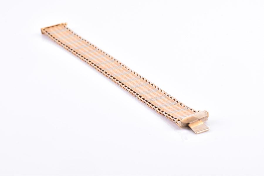 A tri-coloured gold bracelet   marked 750 (tests as (1 of 7)