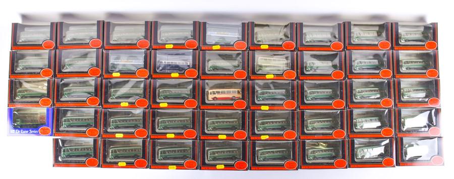 A large quantity of EFE model buses largely comprising: A large quantity of EFE model buses largely comprising 'Grenadier Coach Premier Travel', ex-shop stock, contained in two boxes. (44)
