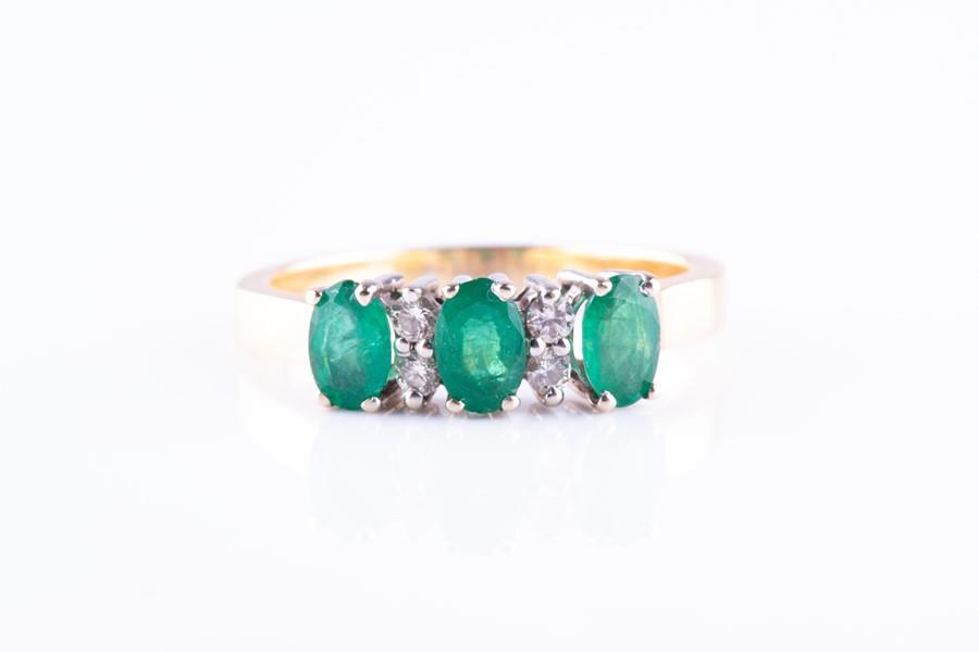 A yellow metal, diamond and emerald ring  set with (1 of 3)