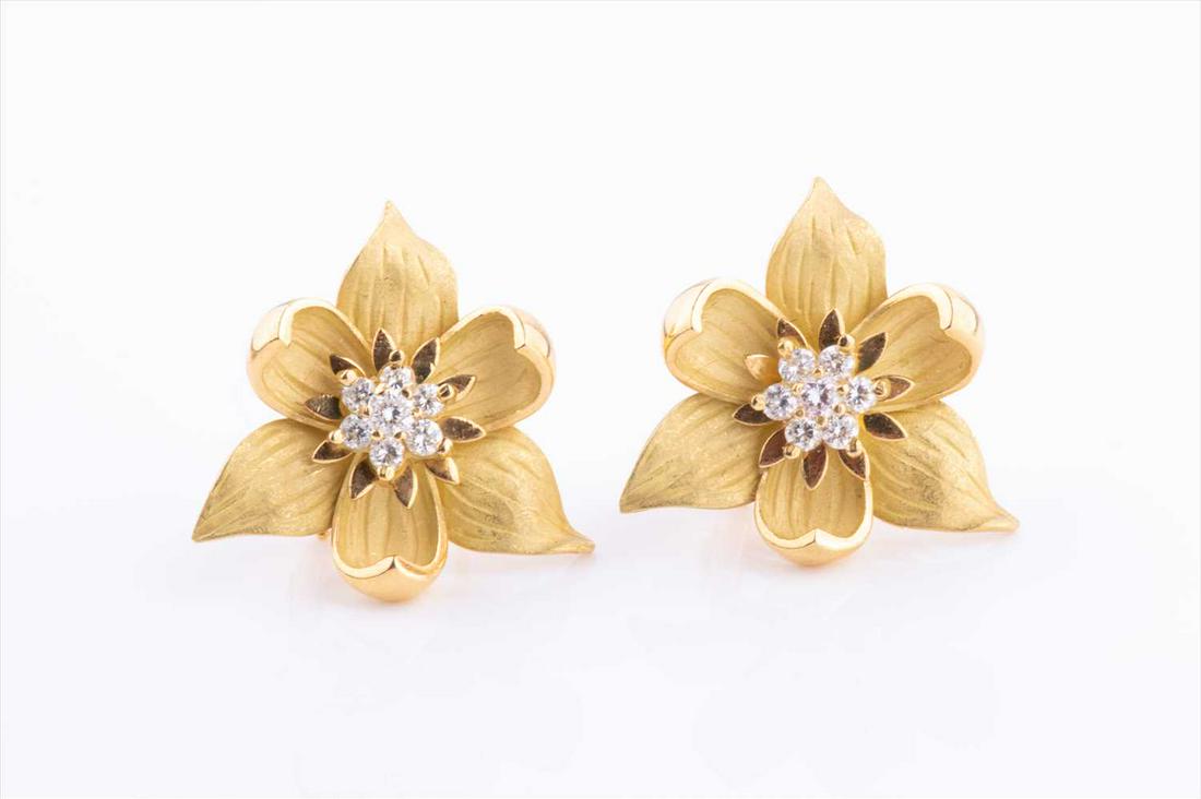 An 18ct yellow gold and diamond floral brooch and (1 of 3)