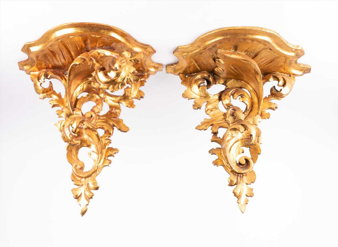 A pair of gilt wall sconces with scroll decoration in (1 of 7)